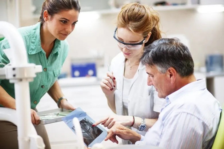 patient looking at treatment options with staff